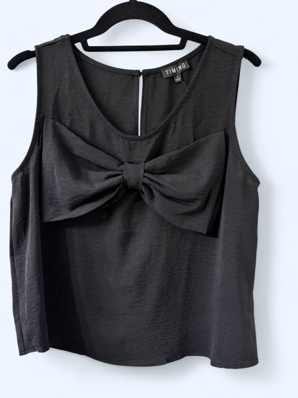 Timing Statement Bow Sleeveless Blouse in Black | Size Large